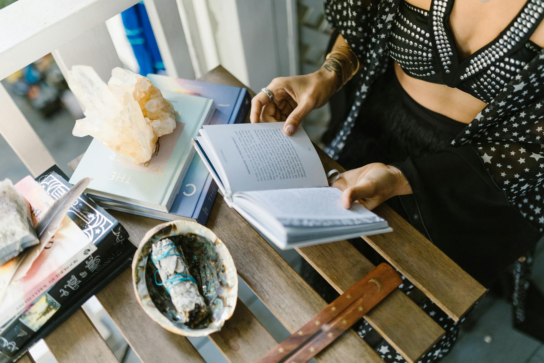 A Person in Black Dress Reading a Book